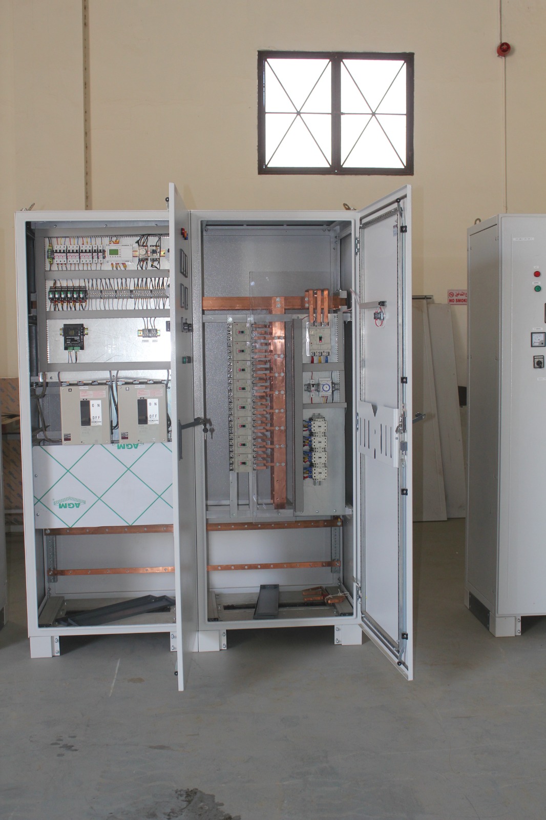 Open electrical panel showing power and control wiring